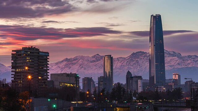  Sunset in Santiago, Chile, overlooking the Costanera Center skyscraper with the snow-capped Andes mountain range.