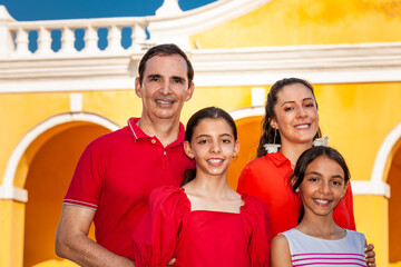 Young family of four traveling together. Family love concept. Travel concept. Cartagena de Indias.