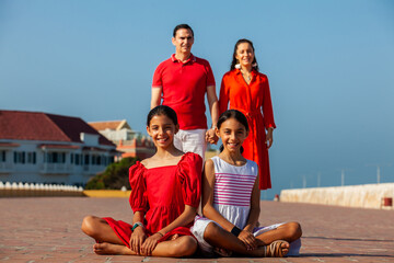 Young family of four traveling together. Family love concept. Travel concept. Cartagena de Indias.