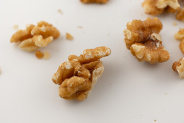 This inviting close-up captures a pile of fresh walnut halves and pieces, exuding a sense of natural goodness and healthy indulgence. Perfect for baking, healthy snacking, or superfood content