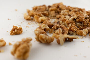 This inviting close-up captures a pile of fresh walnut halves and pieces, exuding a sense of natural goodness and healthy indulgence. Perfect for baking, healthy snacking, or superfood content