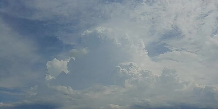 Natural blue sky with moving white clouds Cumulus, Cumulonimbus calvus, Cumulonimbus capillatus and Cumulus congestus on sunny and stormy summer weather - timelapse. Topics: cloudscape, meteorology