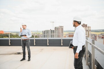 Indian and European construction workers together at a construction site