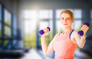 fit woman in her forties lifting weights
