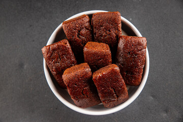 Financier biscuit chocolate cookie sweet dessert fresh delicious gourmet food background on the table rustic food top view copy space