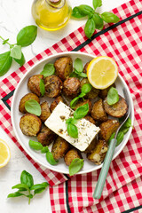 Greek Baked New Potatoes with Garlic and Feta.top veiw.selective focus