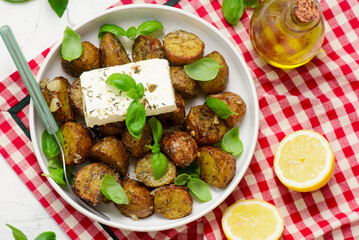Greek Baked New Potatoes with Garlic and Feta.top veiw.selective focus