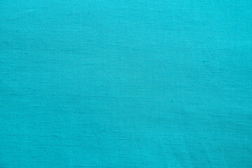 Turqouise blue fabric texture detail closeup as textile background