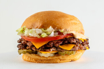A catalog of burgers in different varieties with potato buns, meat and vegan medallions with lettuce, tomato, bacon, cucumbers, cheddar cheese, and American-style caramelized onions.
