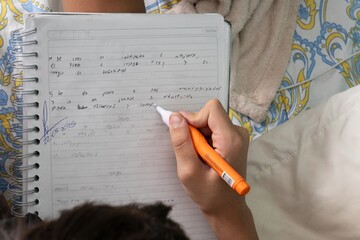 Writing correction on spiral notebook