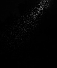 dust snow sparkle rain illustration isolated on black background with projector light. Realistic rain drops image with dark and light. Rain drops on darkness. Spring autumn raindrops concept. Storm