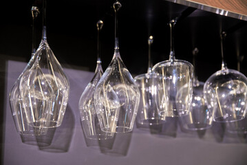 Transparent glass goblets on a dark background