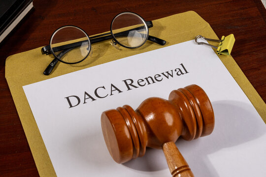 DACA Renewal Document with Gavel and Pen &ndash; Immigration Policy and Legal Protection Concept