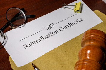 Naturalization Certificate Document on Table with Gavel – Citizenship Law Concept