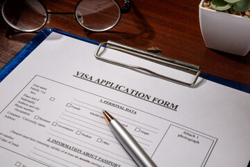 Visa Application Form in Clipboard on Desk – Immigration Document Scene
