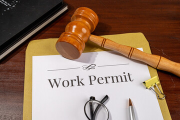 Work Permit Document on Desk Beside Gavel – Immigration Law Theme