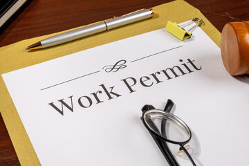 Work Permit Document on Desk Beside Gavel – Immigration Law Theme