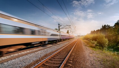 Fototapeta premium a train is moving down the tracks