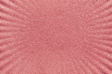 Cosmetic beauty product pressed luminous blusher  textured background nude red colored