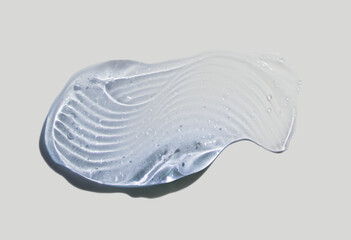 Liquid gel cosmetic smudge texture transparent gray background. Skin care beauty product