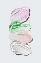 Cosmetic exfoliator serum or mask, moisturizer gel set assortment. Cica or aloe gel, butter, microcapsules, acids isolated on grey