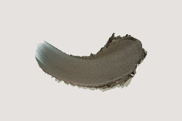 Cosmetic make up brown gray matte metallic swatch on beige background