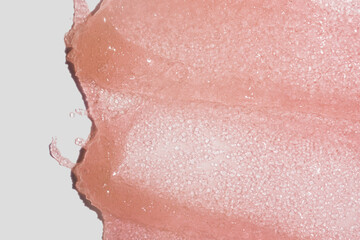 Cosmetic pink beauty product cream jelly swatch or scrub pink swatch textured background