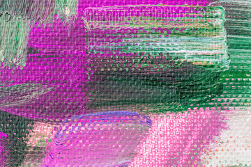 Beautiful bright colorful canvas painted background. Abstract creative brush drawing fashion colors on canvas surface. Closeup pink , red , orange , green, crimson , purple texture