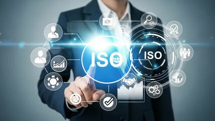 Person in suit touching iso graphic interface with icons and bright light on a gray background - Powered by Adobe