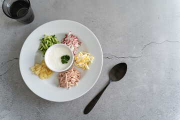 Ready to serve tasty okroshka on light gray background