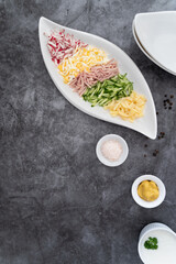 Prepared ingredients ready to be mixed in okroshka