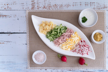 Prepared ingredients ready to be mixed in okroshka