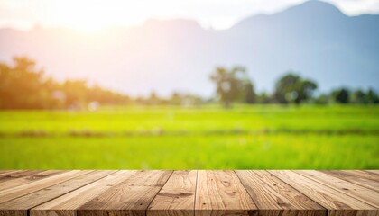 Wooden table in front of a blurred green rice paddy landscape