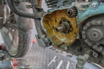 Mechanic checking gearbox in a workshop