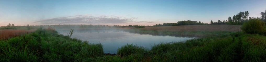 Panorama lake view in sunrise time.Sunrise at the lake