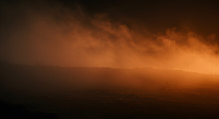 Fototapeta premium Eerie and atmospheric landscape shrouded in orange fog.