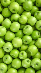 Fresh ripe green apples as background, top view.Vertical photo 