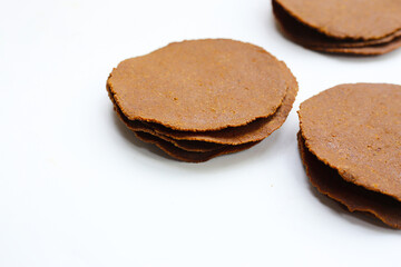 Fermented soybean discs, known as “Thua Nao,” a traditional Thai seasoning used to enhance flavor in Northern cuisine.