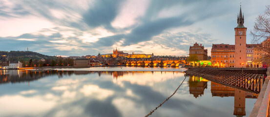Sunset view of Vltava River with Charles Bridge and landmarks in Prague Czech Republic