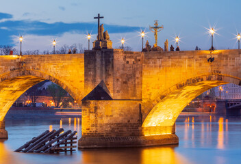 Night view of Charles Bridge with statues and lights in Prague Czech Republic