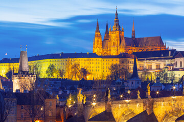 Illuminated St Vitus Cathedral and Charles Bridge at night in Prague Czech Republic