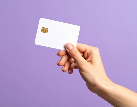 Close up female hand holds levitating template mockup Bank credit card with online service isolated on purple background