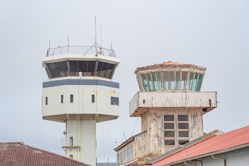 Comparison between two control towers, one in operation, and the other old and degraded, deactivated at Santa Maria airport, Azores, Portugal.