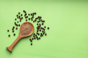 Piper nigrum - Aromatic black pepper spices in a spoon