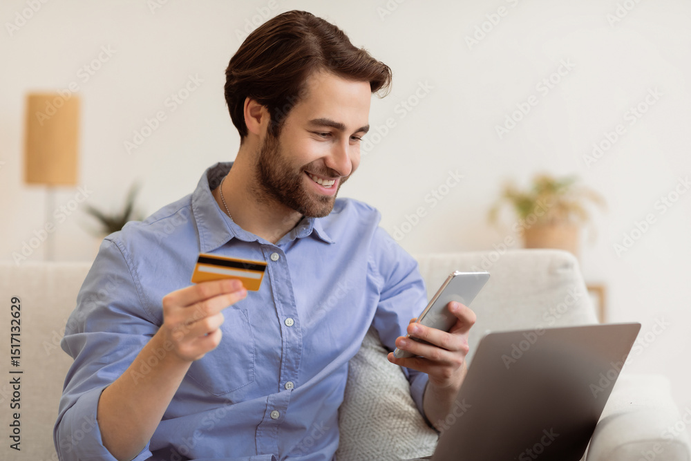 Poster mobile banking app. smiling guy with phone and credit card shopping online sitting with laptop on so