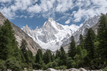 breathtaking view of pik labroche surrounded by majestic mountains and light clouds drifting in sky