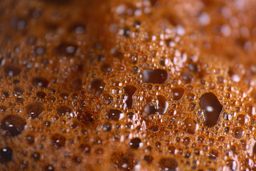 Macro shot of espresso coffee bubbles as background