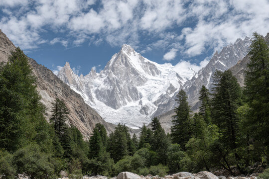 breathtaking view of pik labroche surrounded by majestic mountains and light clouds drifting in sky