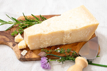 Traditional italian food, 36 months aged in caves Italian parmesan hard cheese from Parmigiano-Reggiano, Italy