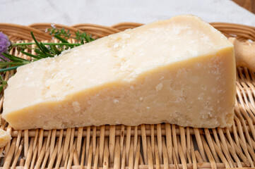 Traditional italian food, 36 months aged in caves Italian parmesan hard cheese from Parmigiano-Reggiano, Italy